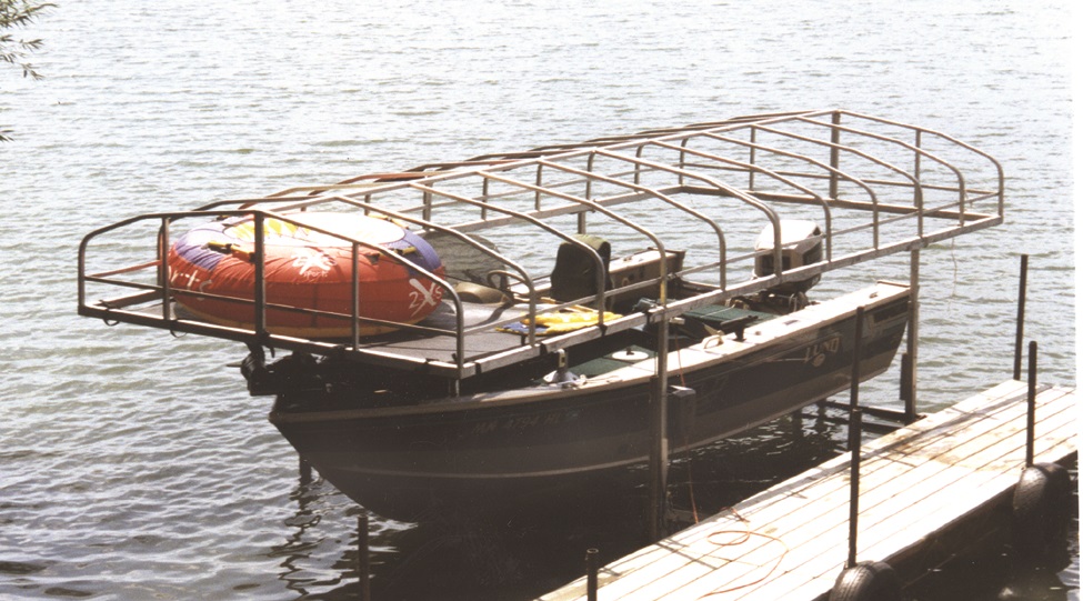 Pontoon lift canopy storage net for storing water toys and gear at the lake.